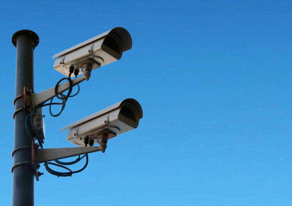 2 security cameras on a pole