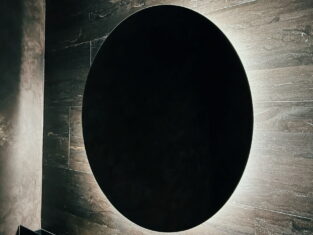 large dark backlight on sandstone wall