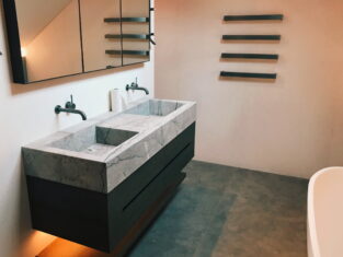 lightd underneath vanity in a bathroom