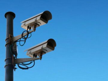 2 security cameras on a pole